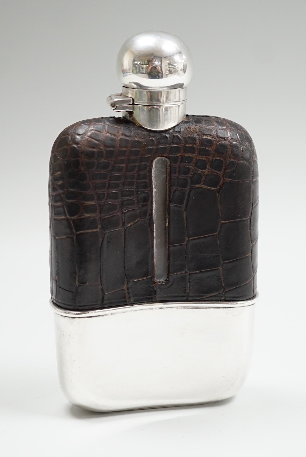 A George V silver and leather mounted glass hip flask, Mappin & Webb, Sheffield, 1923, 15cm.
